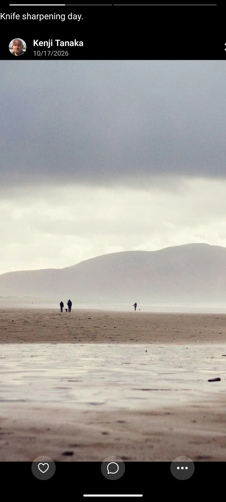 Full-screen story of a misty beach with a caption, Kenji Tanaka's name and date, progress bars at the top and like, comment and more buttons