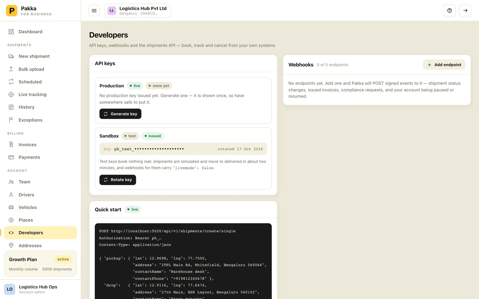 Developers page with production and sandbox API key cards, webhooks panel and quick start code